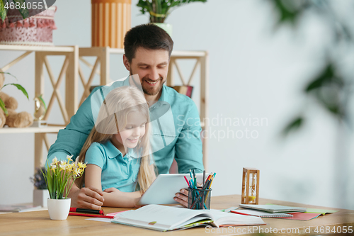 Image of Young happy family are spending time together. A day with loved ones at home.