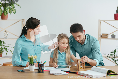 Image of Young happy family are spending time together. A day with loved ones at home.