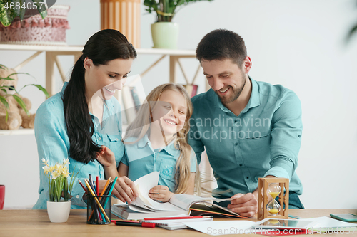 Image of Young happy family are spending time together. A day with loved ones at home.