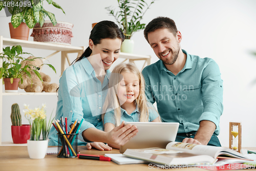 Image of Young happy family are spending time together. A day with loved ones at home.