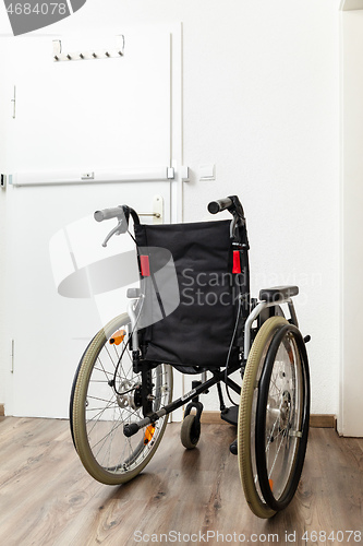 Image of Wheelchair at an apartment door