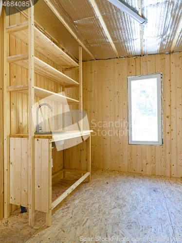 Image of Construction of a country house. Installed homemade yet stylish wood kitchen