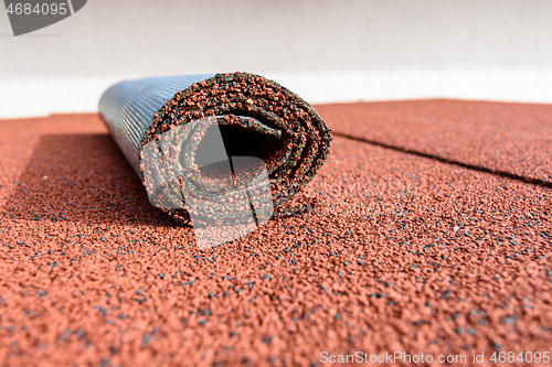Image of On the roof covered with roll tiles, there is a residue in a roll