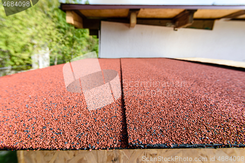 Image of For the roof, a red roll flexible bituminous tile was used