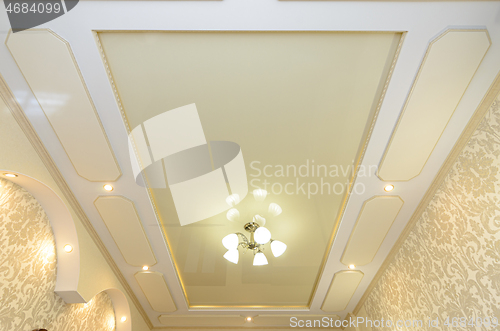 Image of Beautiful original rich multi-level stretch ceiling in the interior of the room