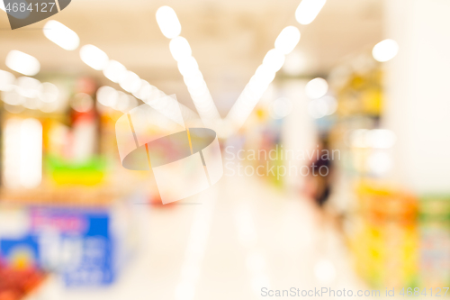 Image of Blur image of aisle in supermarket with customers 