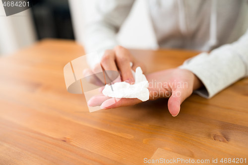 Image of Woman getting wet on hand