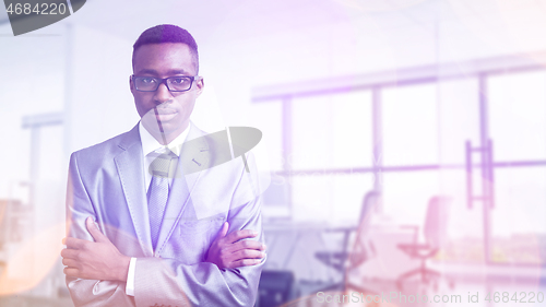 Image of Young businessman in his office