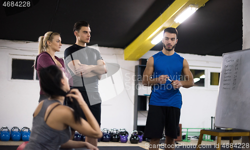 Image of athletes getting instructions from trainer