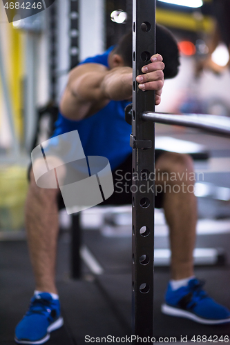 Image of man doing pull ups on the vertical bar