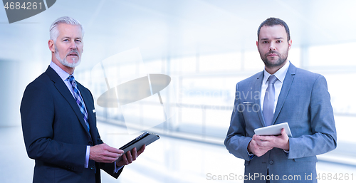 Image of Portrait of two colleague businessmans