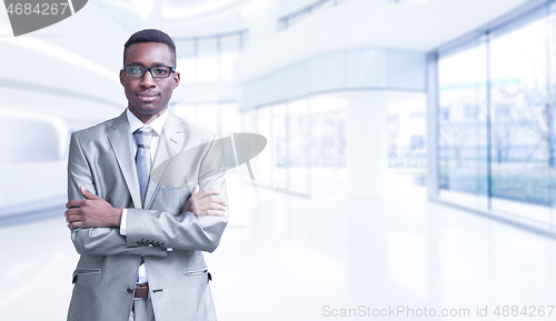 Image of Young businessman in his office