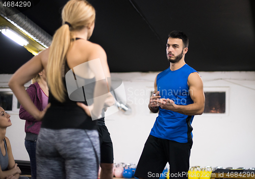 Image of athletes getting instructions from trainer