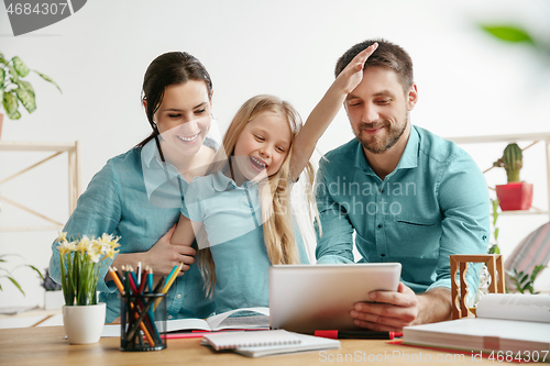 Image of Young happy family are spending time together. A day with loved ones at home.