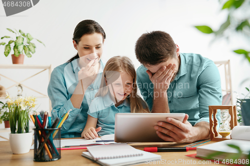 Image of Young happy family are spending time together. A day with loved ones at home.