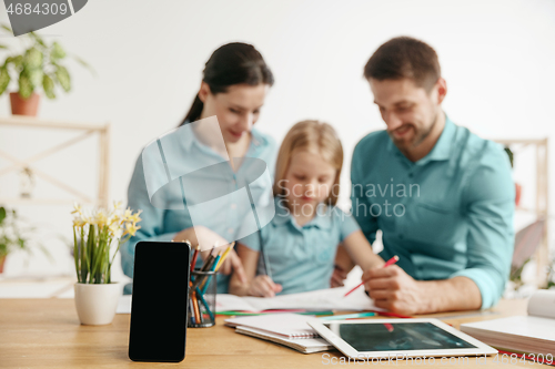 Image of Young happy family are spending time together. A day with loved ones at home.