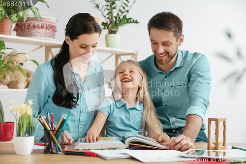 Image of Young happy family are spending time together. A day with loved ones at home.