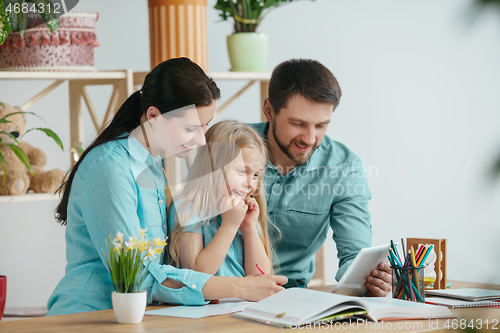 Image of Young happy family are spending time together. A day with loved ones at home.