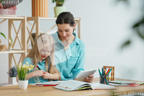 Image of Young happy family are spending time together. A day with loved ones at home.