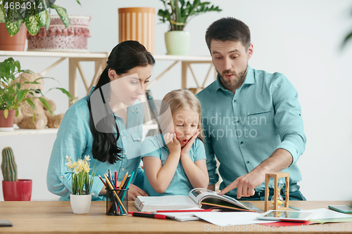 Image of Young happy family are spending time together. A day with loved ones at home.