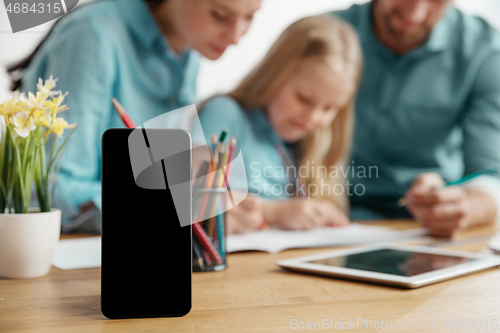 Image of Young happy family are spending time together. A day with loved ones at home.