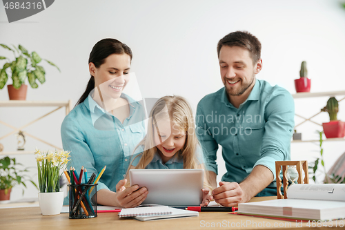 Image of Young happy family are spending time together. A day with loved ones at home.