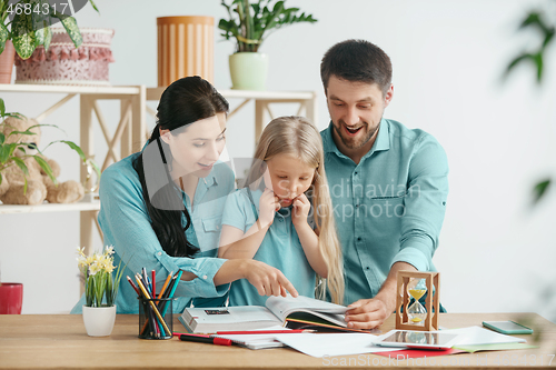 Image of Young happy family are spending time together. A day with loved ones at home.