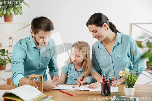 Image of Young happy family are spending time together. A day in lovely home.