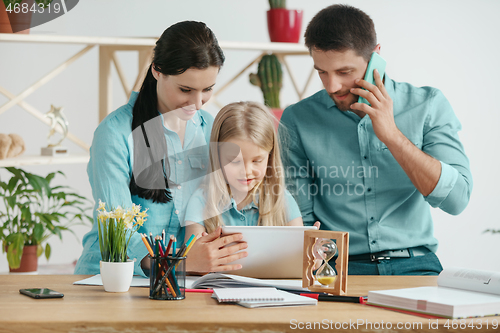 Image of Young happy family are spending time together. A day with loved ones at home.