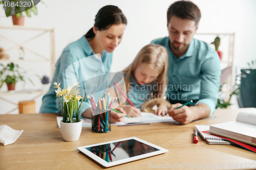 Image of Young happy family are spending time together. A day with loved ones at home.