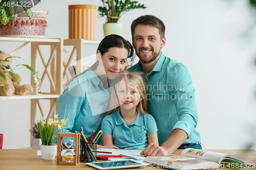 Image of Young happy family are spending time together. A day with loved ones at home.