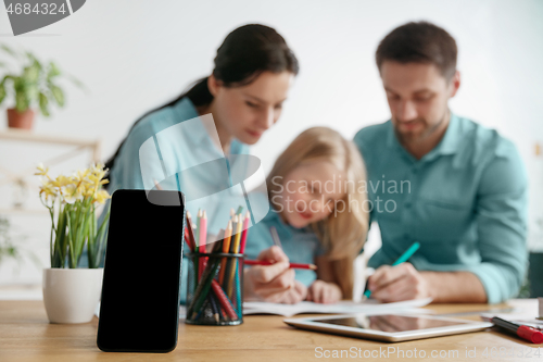 Image of Young happy family are spending time together. A day with loved ones at home.