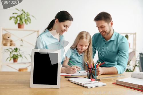 Image of Young happy family are spending time together. A day with loved ones at home.