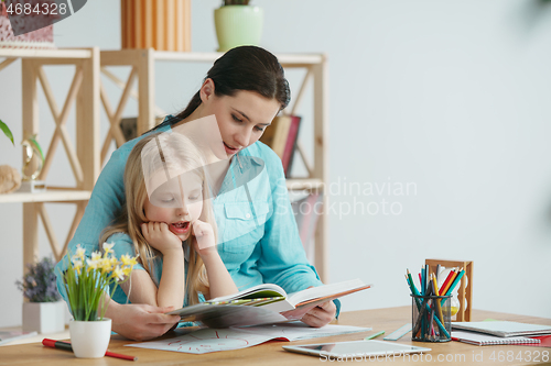 Image of Young happy family are spending time together. A day with loved ones at home.