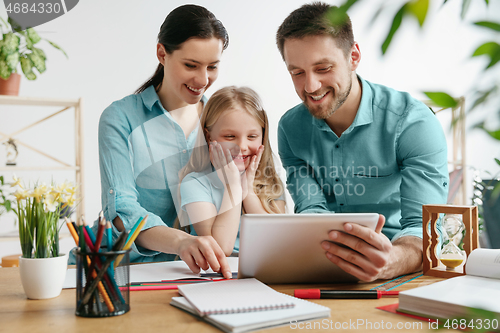 Image of Young happy family are spending time together. A day with loved ones at home.