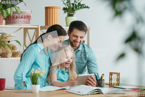 Image of Young happy family are spending time together. A day with loved ones at home.