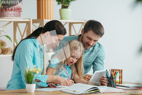 Image of Young happy family are spending time together. A day with loved ones at home.