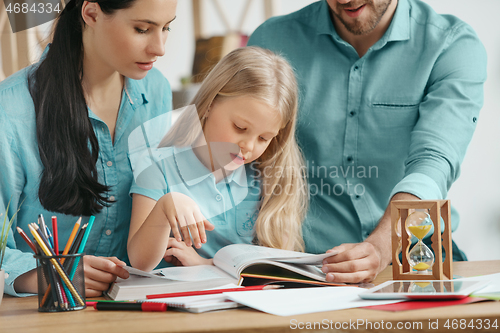 Image of Young happy family are spending time together. A day with loved ones at home.