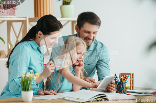 Image of Young happy family are spending time together. A day with loved ones at home.