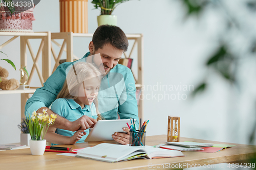 Image of Young happy family are spending time together. A day with loved ones at home.