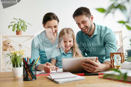 Image of Young happy family are spending time together. A day with loved ones at home.