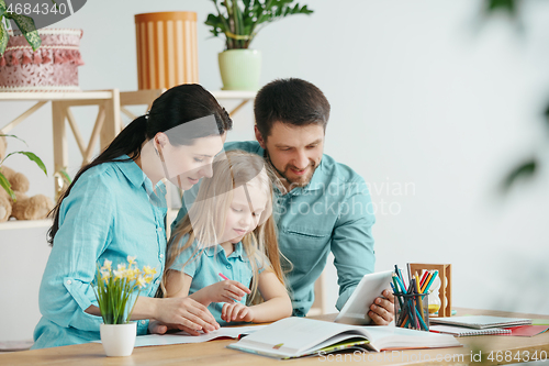 Image of Young happy family are spending time together. A day with loved ones at home.