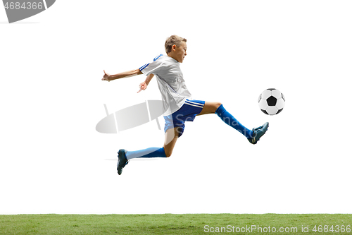 Image of Young boy with soccer ball isolated on white. football player