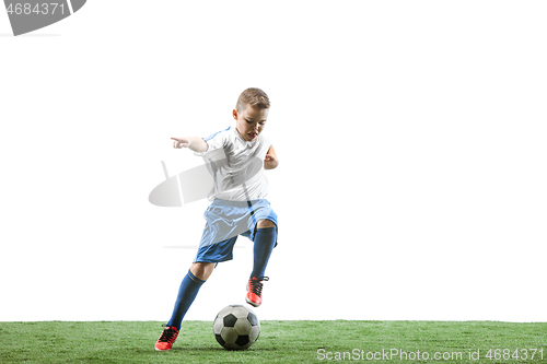 Image of Young boy with soccer ball isolated on white. football player