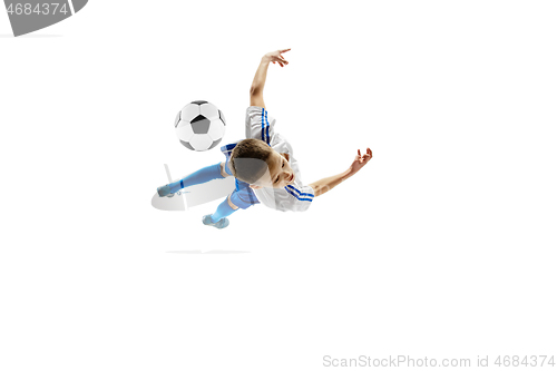 Image of Young boy with soccer ball isolated on white. football player