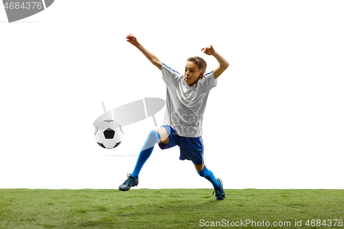 Image of Young boy with soccer ball isolated on white. football player