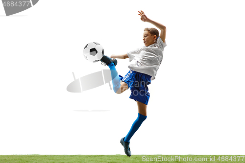 Image of Young boy with soccer ball isolated on white. football player