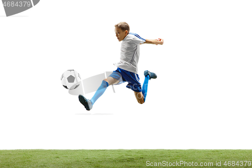 Image of Young boy with soccer ball isolated on white. football player