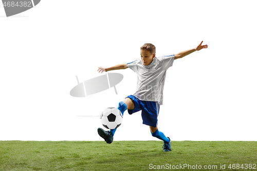 Image of Young boy with soccer ball isolated on white. football player