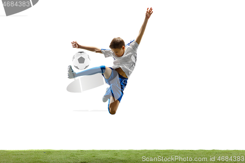 Image of Young boy with soccer ball isolated on white. football player